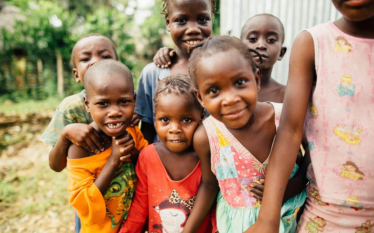Children receiving clothing donations